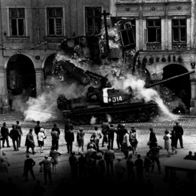 Prague Spring - Suppression Invasion of Czechoslovakia by troops of the Warsaw Pact countries| a Soviet tank is driving into the facade of a building and causing its collapse| passersby are watching the scene or taking cover